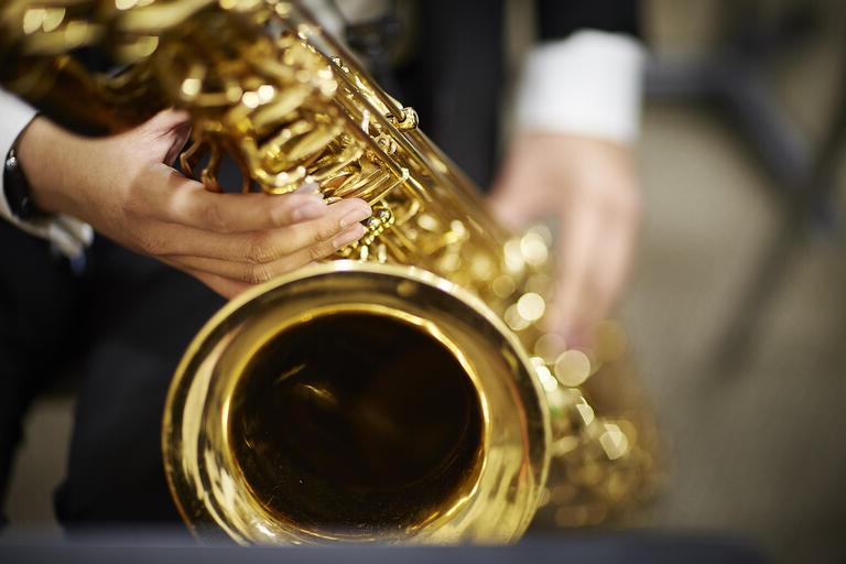 A person playing the saxophone